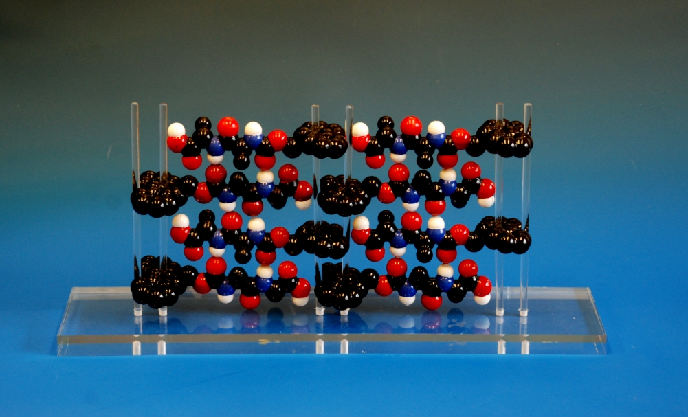 An assembly of 3d printed Fmoc (Fluorenylmethyloxycarbonyl) molecules mounted on a perspex acrylic frame