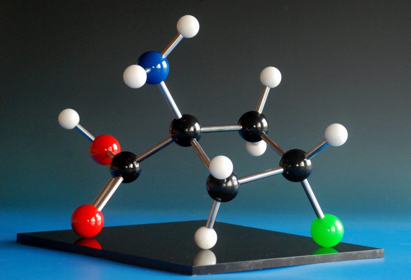 A large molecular model of the drug Fluciclovine, made with phenolic balls and aluminium rods on an acrylic base
